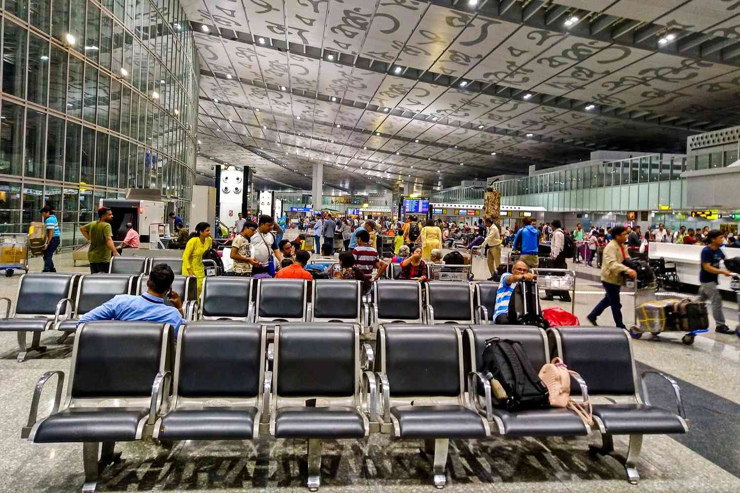 Traveler looking for lost luggage or personal belongings at Kolkata Airport terminal