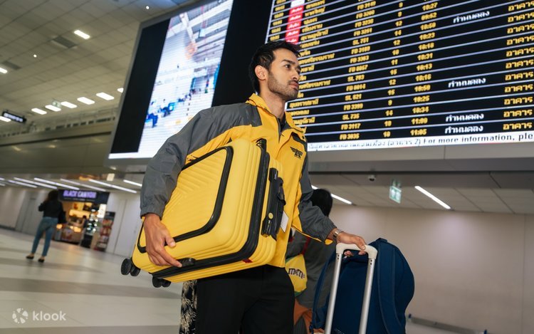 Traveler sending excess baggage from airport to home through a luggage delivery service