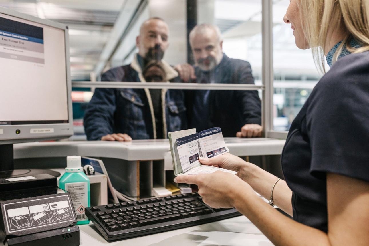 Use an image of an airport lost and found counter, luggage at an airport, or a passenger checking documents.